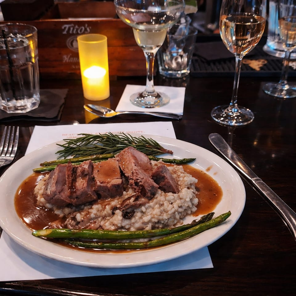 Plated dinner at a candlelit table